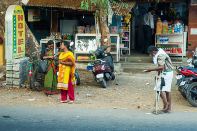 People walking on road in city