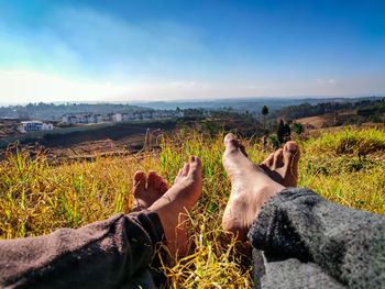 Low section of man relaxing on land