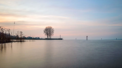 Scenic view of sea against sky at sunset