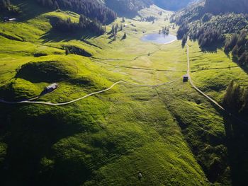 High angle view of green landscape and mountainlake