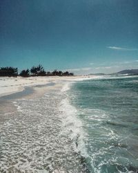 Scenic view of sea against blue sky