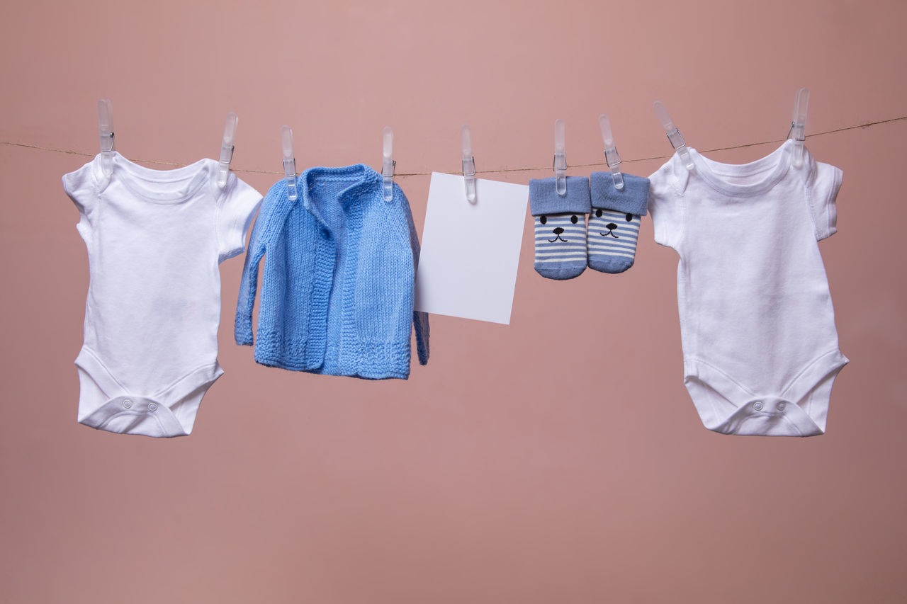 CLOSE-UP OF CLOTHES HANGING ON CLOTHESLINE