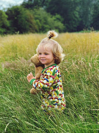 Portrait of girl on grassy field