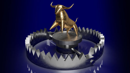 Close-up of statue against blue background