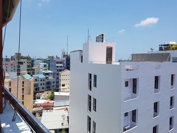 Buildings in city against sky