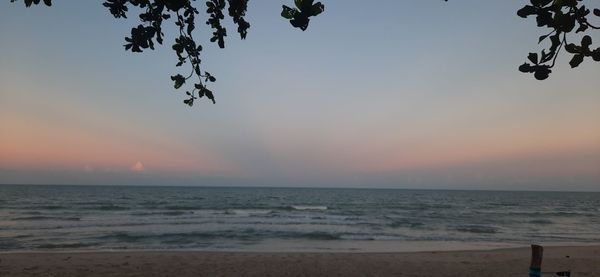 Scenic view of sea against clear sky during sunset