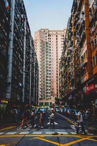 City street and modern buildings against sky