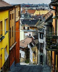 High angle view of street amidst houses in town