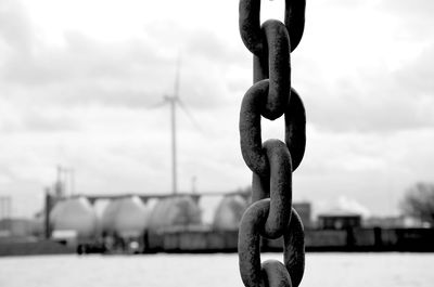 Close-up of chain against sky