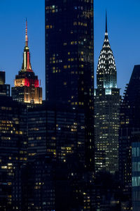 Illuminated buildings in city at night