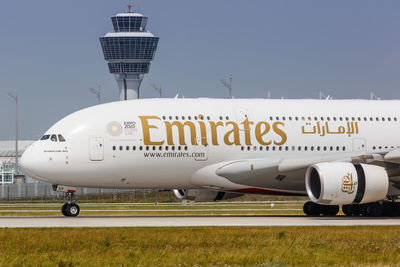 Information sign on airport runway against sky