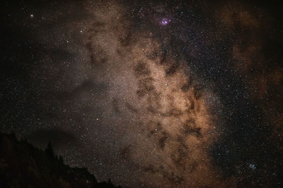 Low angle view of stars in sky at night