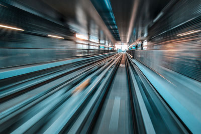 Blurred motion of railroad tracks at subway station