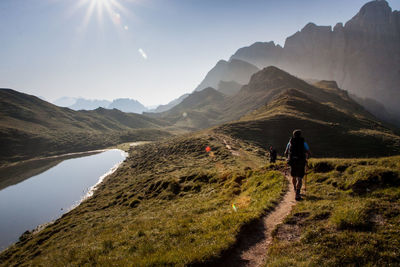 Rear view of man walking on mountain