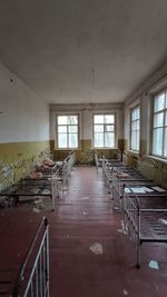 Empty chairs and tables in abandoned building