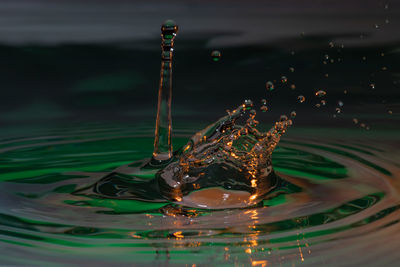 Close-up of water drop on glass looks like a swan