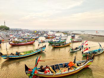 High angle view of boats in sea against sky