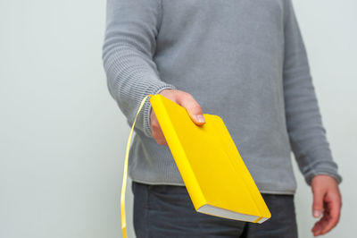 Midsection of woman holding umbrella