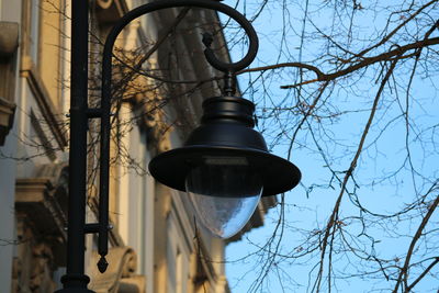 Low angle view of street light against sky