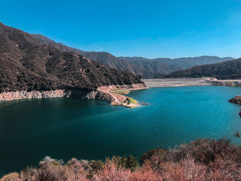 Scenic view of lake against blue sky