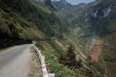 Country road leading towards mountains