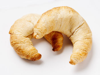 High angle view of bread on white background