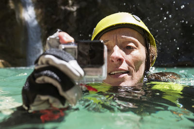 Portrait of man swimming in pool