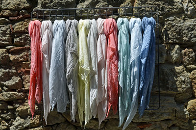 Close-up of clothes hanging for sale