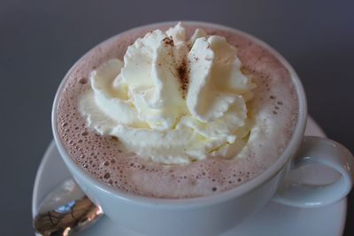 High angle view of fresh whipped cream in hot chocolate on table