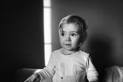 Close-up of cute baby girl at home