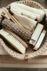 Directly above shot of toiletries in basket on table