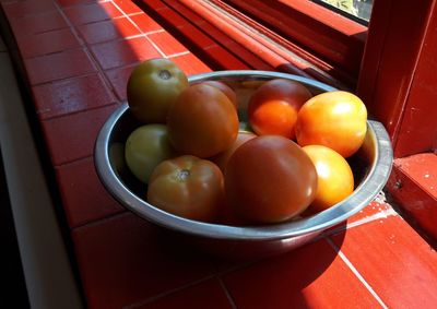 High angle view of fruits in plate on table