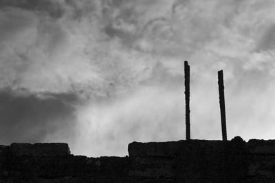 Low angle view of smoke stack against sky