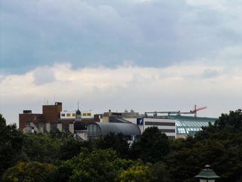 View of buildings against cloudy sky