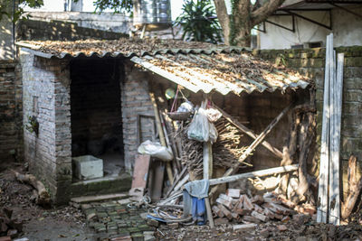 Old abandoned house by building