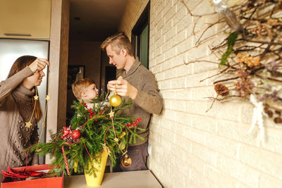 High angle view of man and woman standing by plants