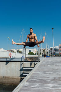 Sportsman practicing stretching and calisthenics