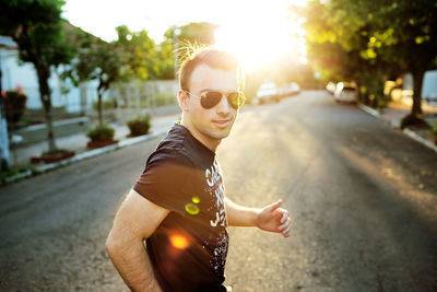 Young man wearing sunglasses on street