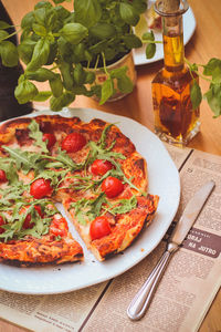 High angle view of pizza served in plate