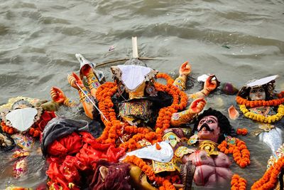 High angle view of figurines in sea