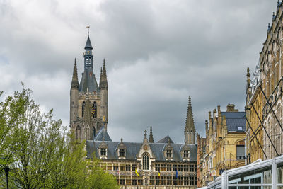 Panoramic view of buildings in city against sky