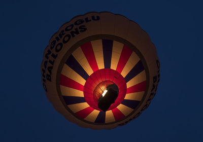 Low angle view of hot air balloons against clear sky