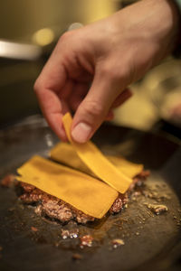 Close-up of person preparing food