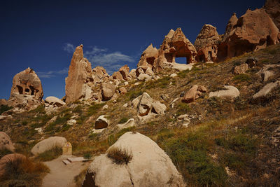 Low angle view of rock formation against sky