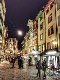 Illuminated buildings in city at night