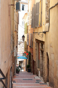 Narrow alley amidst buildings in city