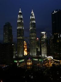 Illuminated buildings in city at night