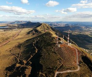 Aerial view of landscape against cloudy sky