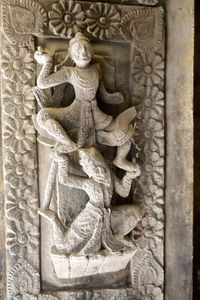 Close-up of buddha statue in temple building