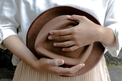 Low angle view of woman touching hands